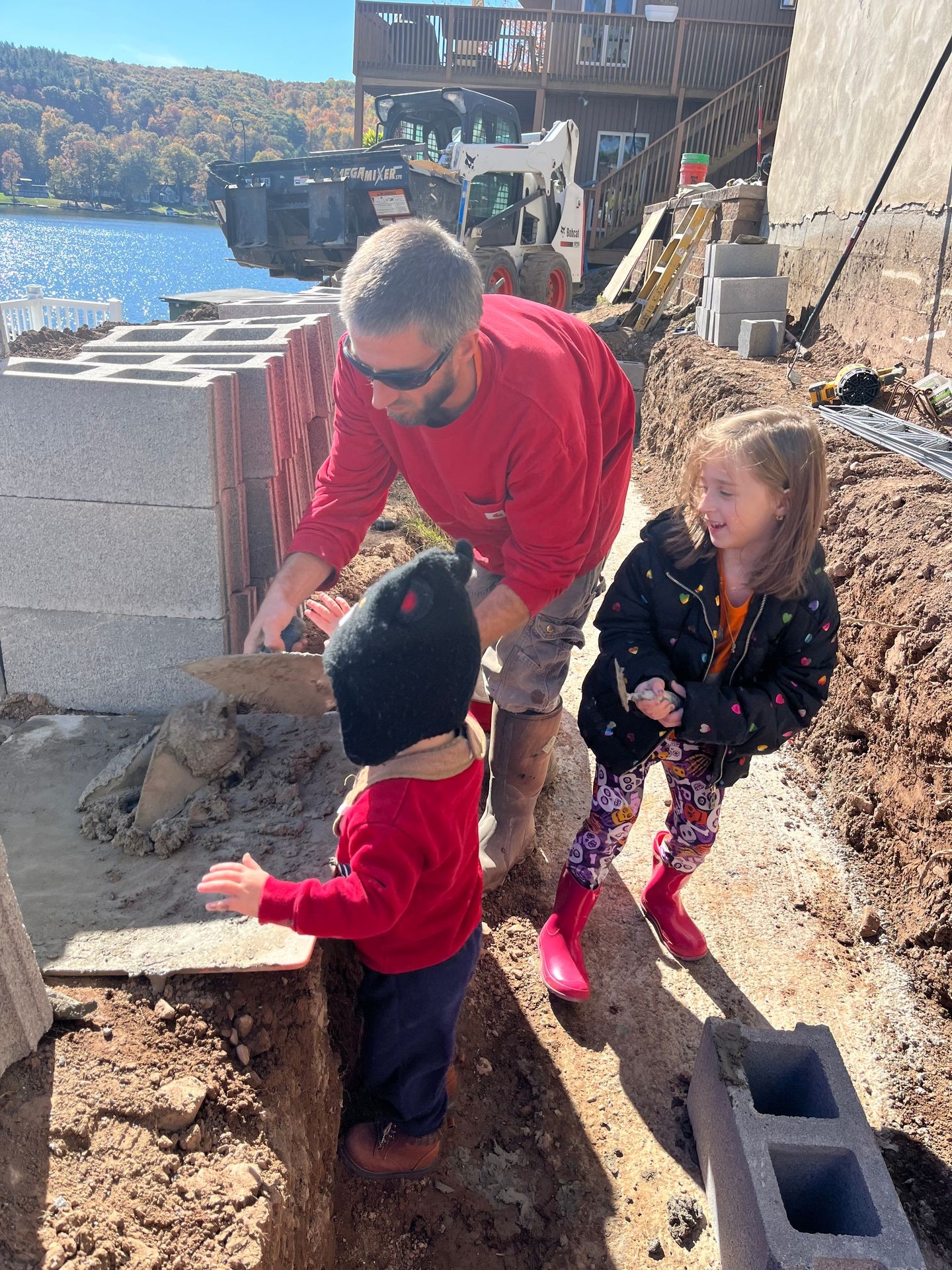 The Frable Family building a CMU retaining wall at Lake Winola Pa